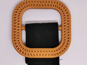 Close-up of wicker basket against wall