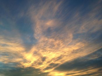 Low angle view of dramatic sky during sunset