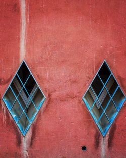 Full frame shot of window on red wall