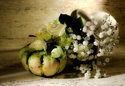 Close-up of white roses on table