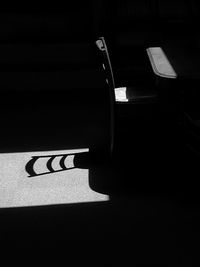 Empty chair and table in darkroom