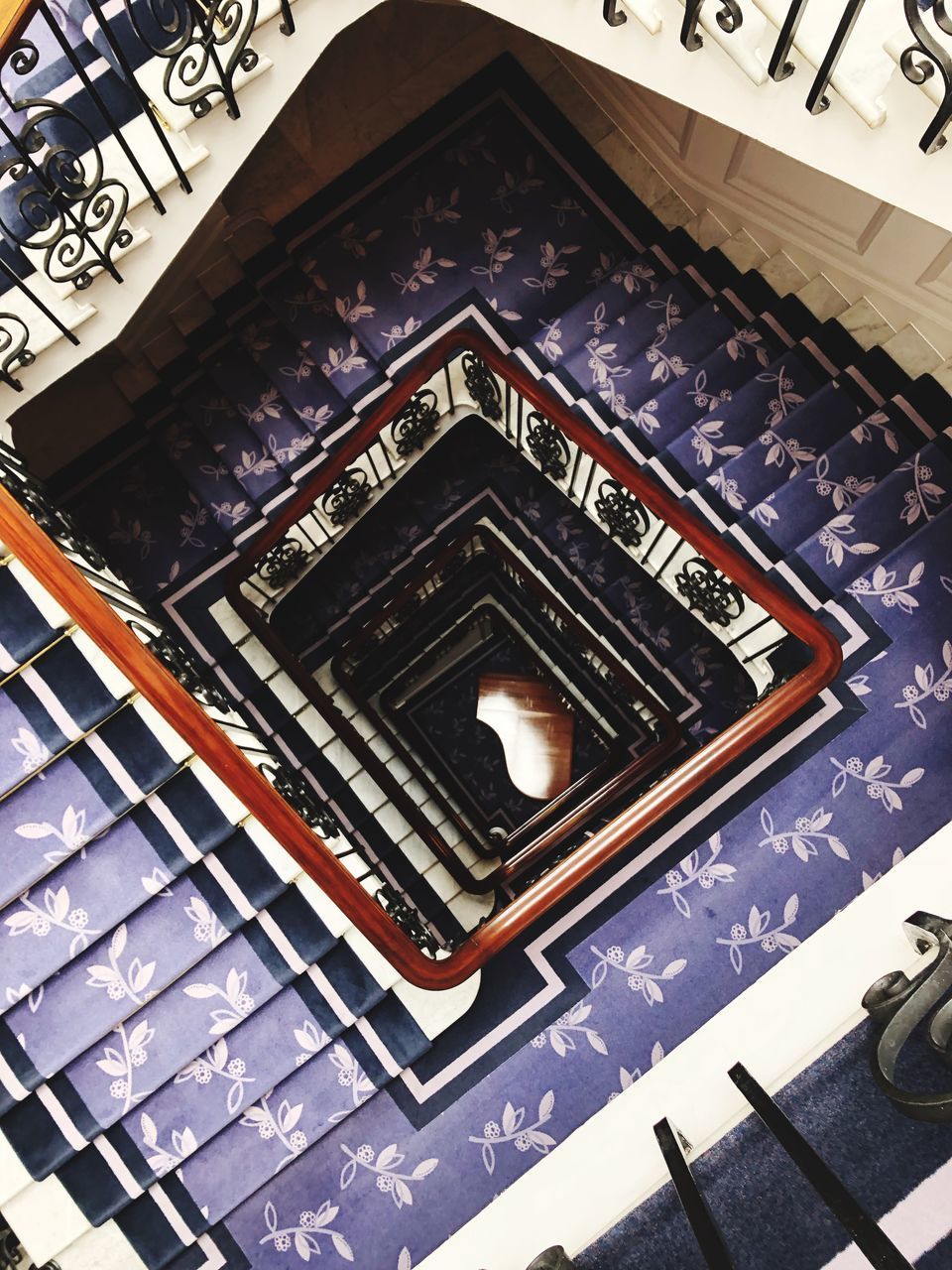 HIGH ANGLE VIEW OF SPIRAL STAIRCASE OF BUILDING