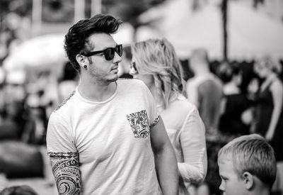 Portrait of young man looking away outdoors