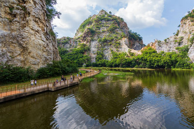 Scenic view of lake and mountains against sky