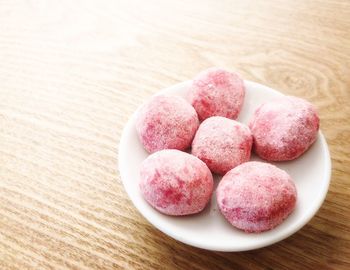 High angle view of strawberries in bowl on table