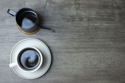 High angle view of coffee cup on table