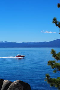 Scenic view of sea against clear blue sky