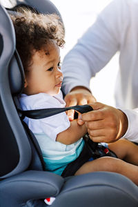 Father with son sitting in car