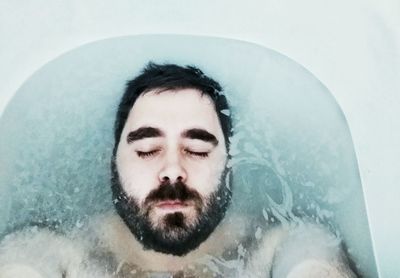 Portrait of young man in bath