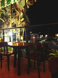 Chairs and tables in cafe at night