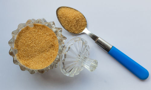 High angle view of cake on table against white background