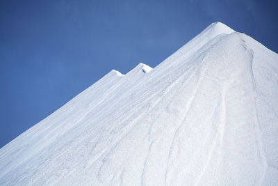 View of salt mountain against clear sky