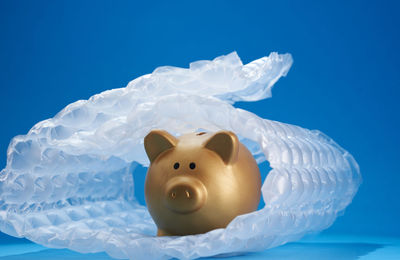 Close-up of stuffed toy against blue background