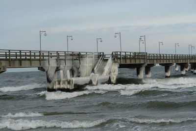 View of bridge over sea against sky