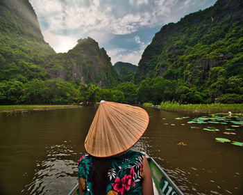 Scenic view of river amidst mountains against sky