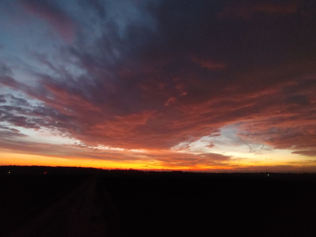 sky, sunset, cloud - sky, beauty in nature, orange color, scenics - nature, tranquility, tranquil scene, silhouette, nature, environment, landscape, idyllic, no people, outdoors, non-urban scene, cloudscape, dark, dramatic sky, direction