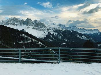 Scenic view of snowcapped mountains against sky during winter