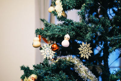 Christmas decorations hanging on tree