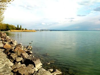 Scenic view of sea against cloudy sky