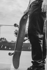 Low section of man standing on street