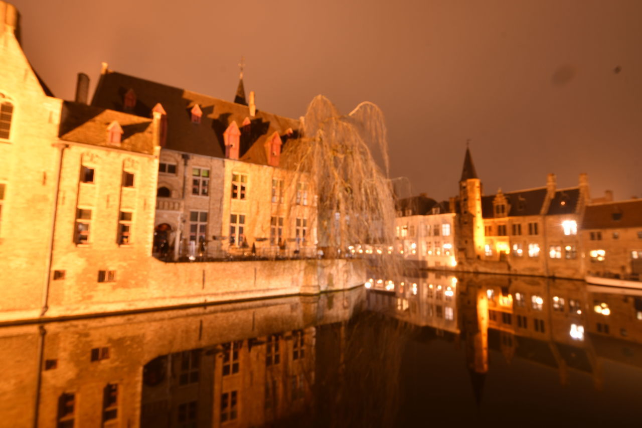 REFLECTION OF ILLUMINATED BUILDINGS IN WATER