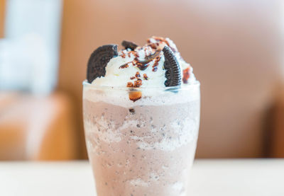 Close-up of ice cream in glass on table