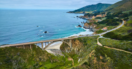 High angle view of sea against mountain