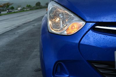 Close-up of illuminated car headlight