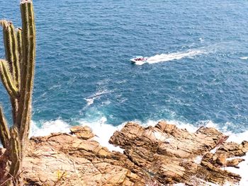 High angle view of rock formation in sea