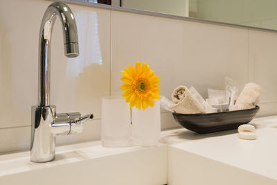 Flower vase on table at home