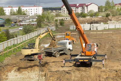 Construction site by road in city