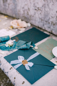 High angle view of white flower on footpath