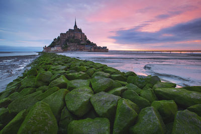 Landscape from the west coast of france at atlantic ocean. sunrise with mont saint michel.