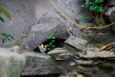 People standing on rock