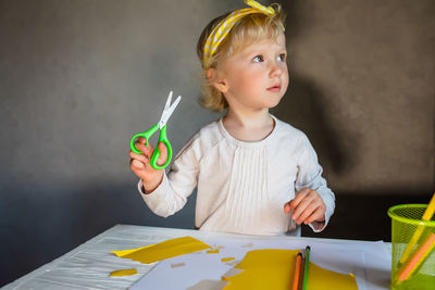 Portrait of boy playing with toy blocks on table