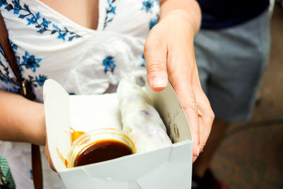 Close-up of hand holding ice cream