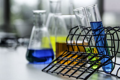 Close-up of test tube rack on table