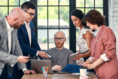 Group of people working on mobile phone