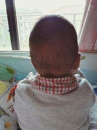 Rear view of boy sitting