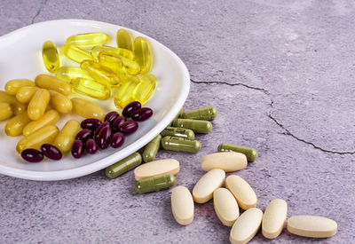 High angle view of candies in plate on table