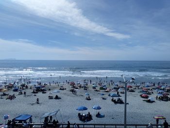 High angle view of people on beach against sky