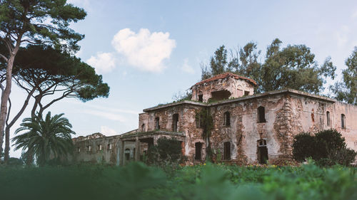 Low angle view of old building against sky