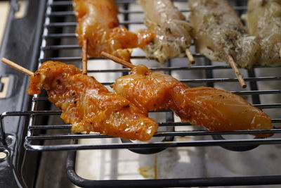 Close-up of serving meat on barbecue grill