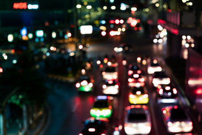 Defocused image of illuminated city at night