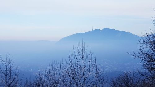 Scenic view of mountains against sky during winter