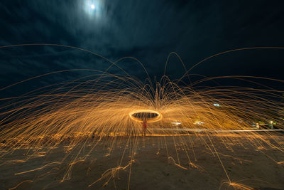 Light trails against sky at night