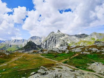 Scenic view of mountains against cloudy sky