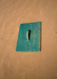 High angle view of wood on sand