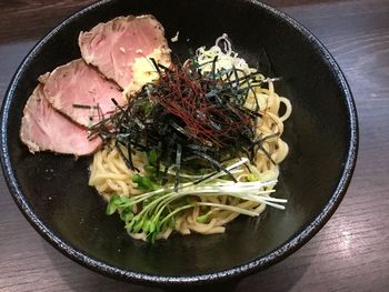 High angle view of ramen noodles in soup bowl on table