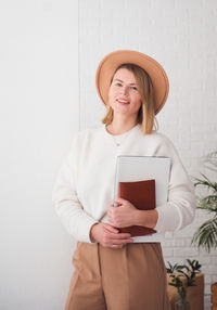 Trendy young woman in hat portrait